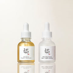 two bottles of liquid with a dropper