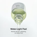 a bottle of liquid dripping from a drop of liquid