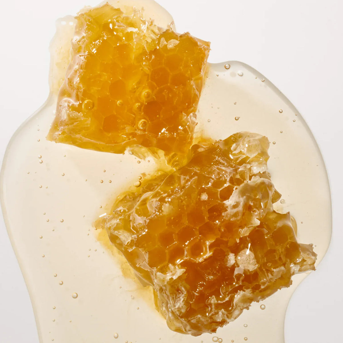 Golden honeycomb on a cream background