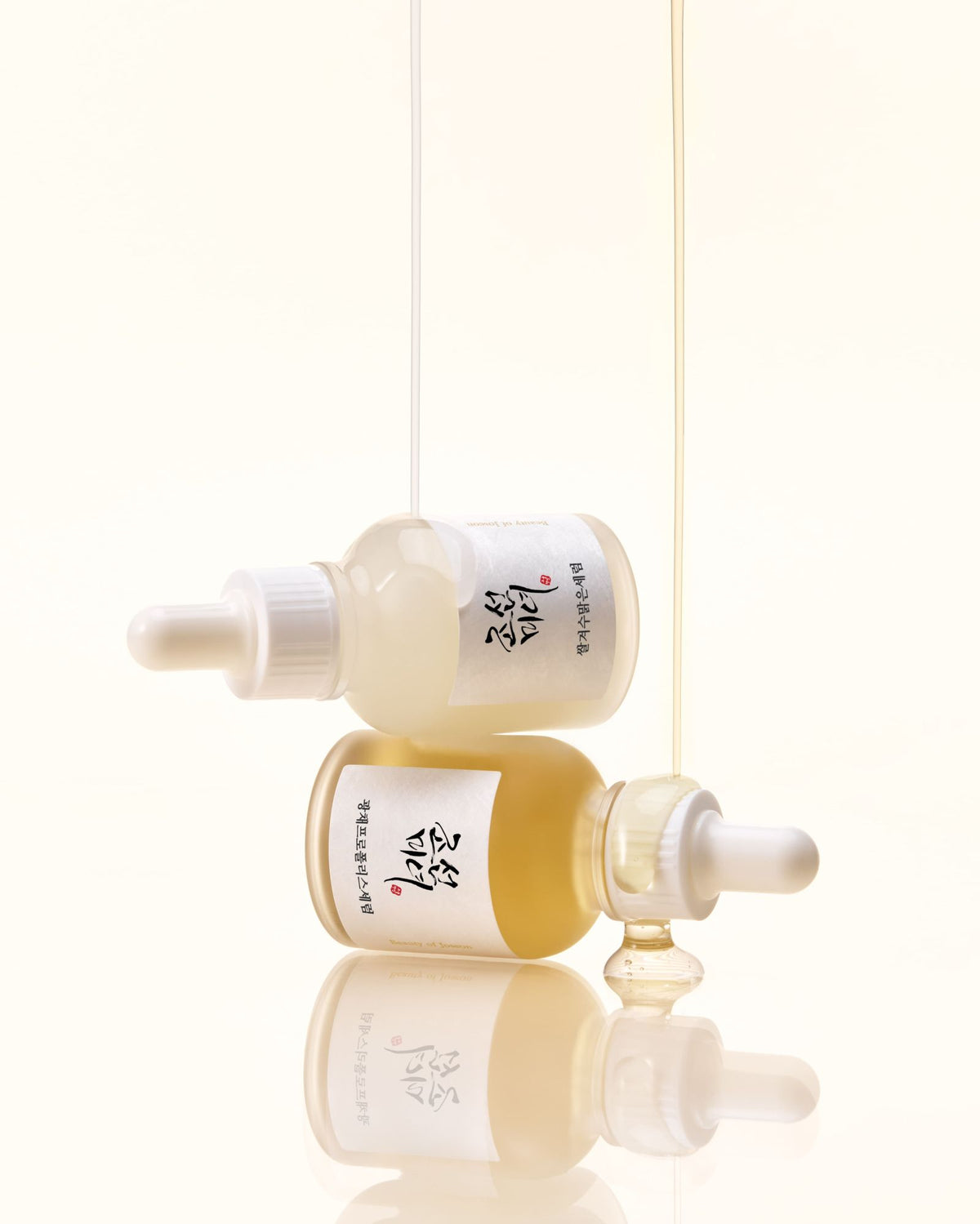 a group of bottles with liquid dripping